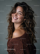 Joyful Woman with Curly Hair Smiling in Cozy Sweater
