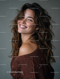 Joyful Woman with Curly Hair Smiling in Cozy Sweater