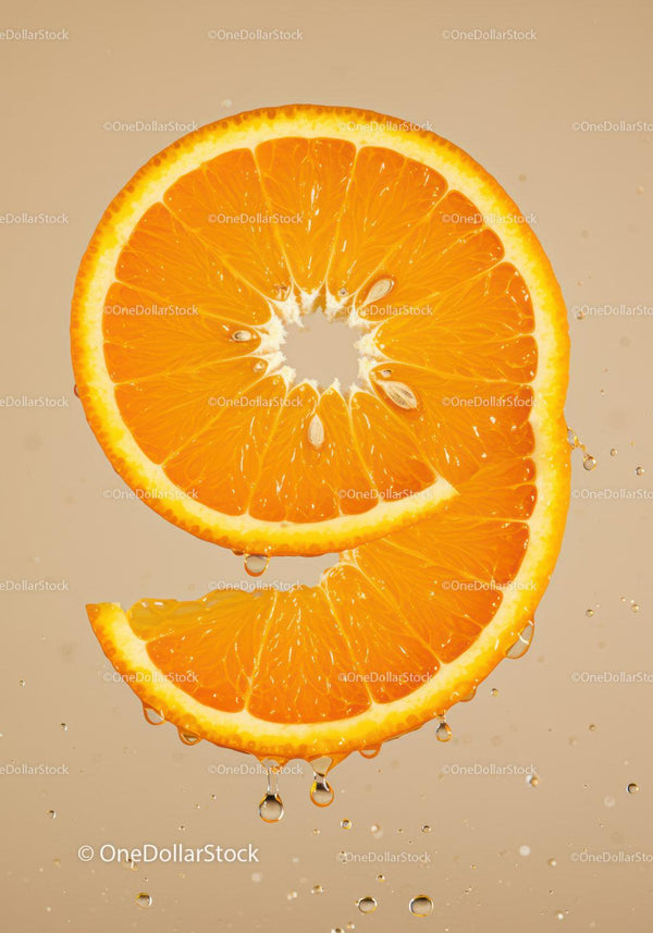 Fresh orange slice with water droplets on beige background