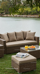 Wicker Sofa and Coffee Table Overlooking Lake with Fresh Fruit and Drink