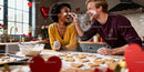 Couple Enjoying Baking Heart-Shaped Cookies Together