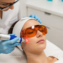 Woman Receiving Laser Skin Treatment in a Modern Clinic
