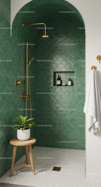 Modern green tiled shower with gold fixtures and natural accents
