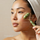 Asian Woman Using Jade Roller for Facial Massage and Skin Rejuvenation