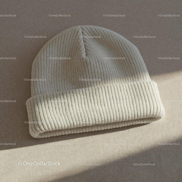 Cozy white knit beanie hat on neutral fabric JPG Mockup Image