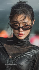 Confident Young Woman in Stylish Black Outfit and Sunglasses