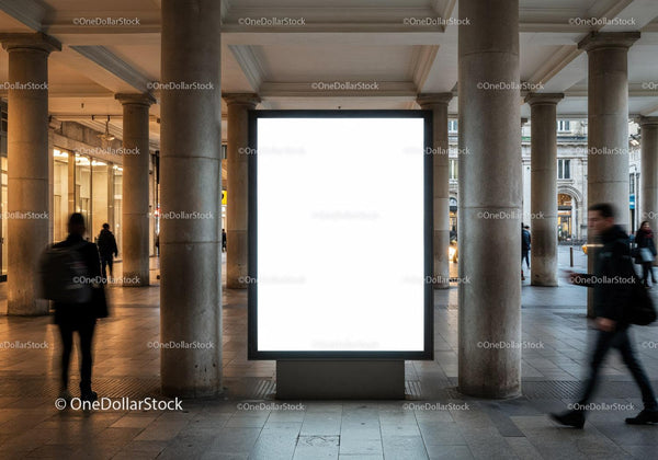 Urban street scene with illuminated empty advertising display JPG Mockup Image