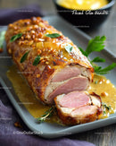 Bacon-Wrapped Stuffed Chicken Breast with Herb Garnish and Sauce