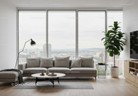 Modern Living Room with City View Featuring Grey Sofa and Indoor Plant