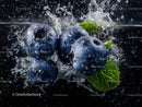 Blueberries Splashing Water with Mint Leaves in Dynamic Close-Up
