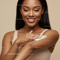 Beautiful Woman Applying Lotion to Arm for Radiant Skin