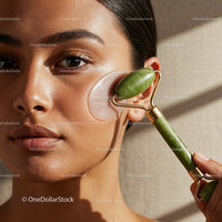 Close-up of a Woman Using a Jade Face Roller for Skin Rejuvenation