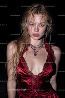 Elegant Young Woman in Red Velvet Dress with Jewelry