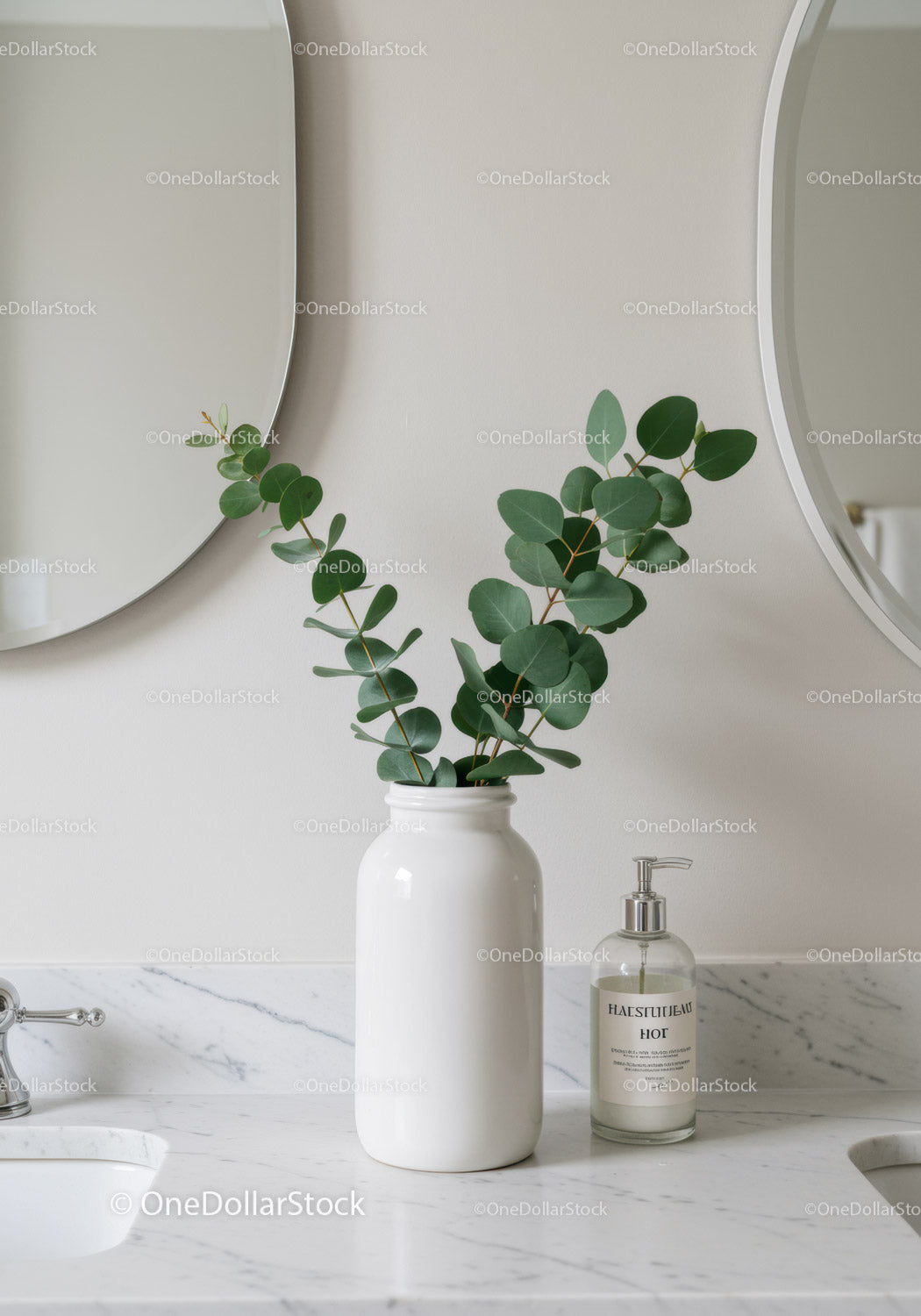 Elegant Bathroom with Eucalyptus in White Vase and Marble Countertop