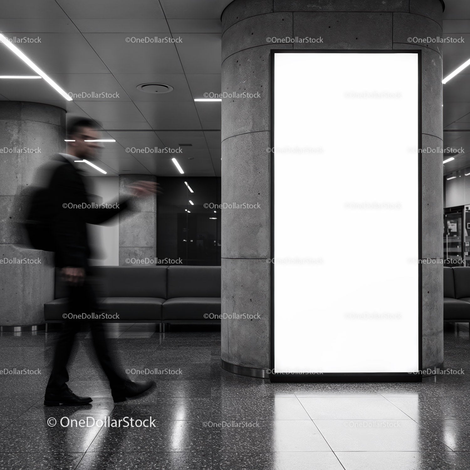 Businessman walking past blank urban lightbox display
