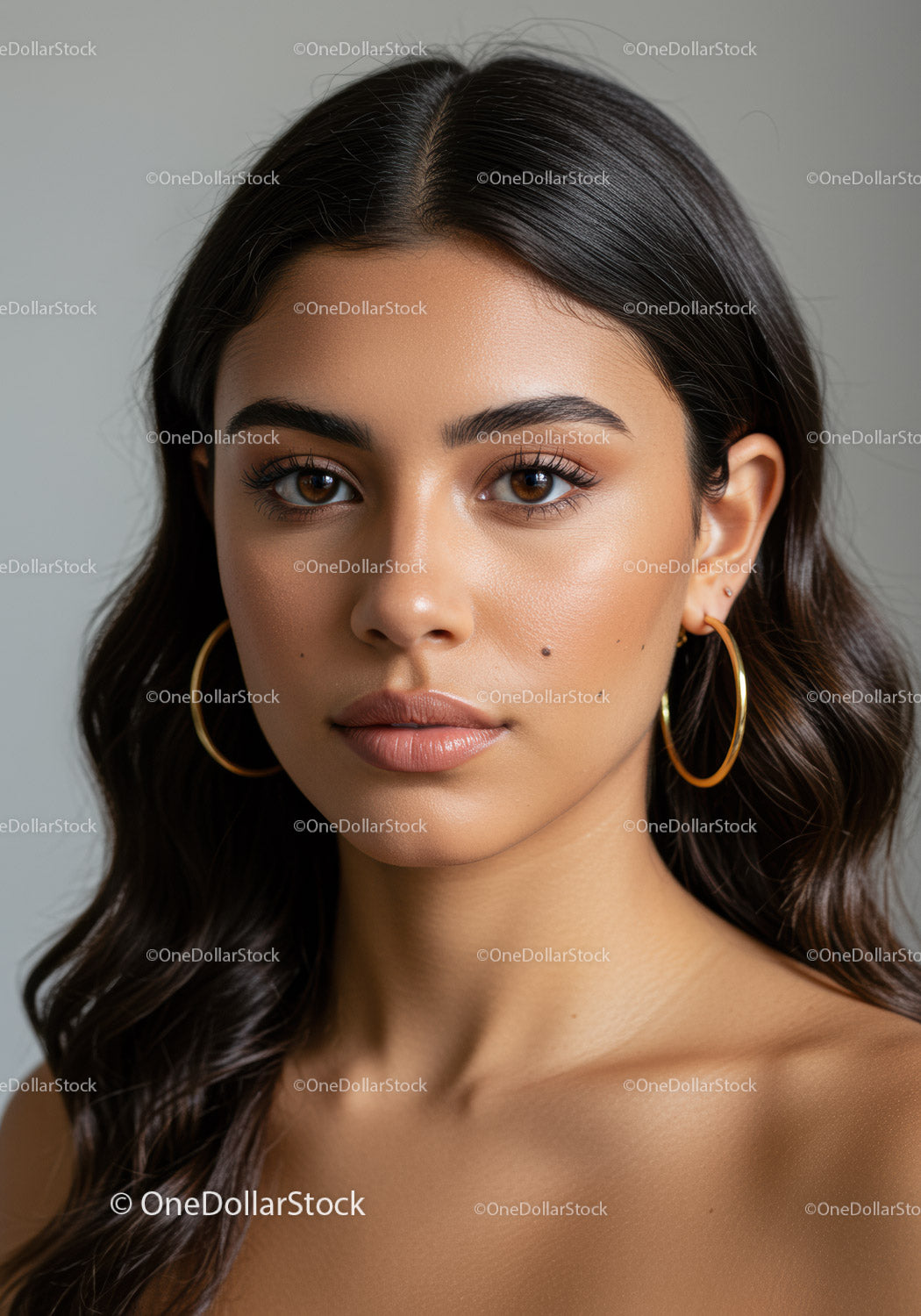 Portrait of a Young Woman with Brown Eyes and Elegant Gold Earrings