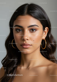Portrait of a Young Woman with Brown Eyes and Elegant Gold Earrings