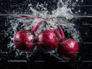 Vibrant Red Radishes Splashing into Water