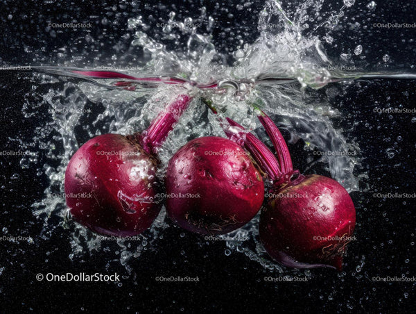 Vibrant Red Radishes Splashing into Water