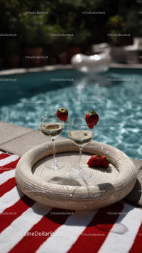 Strawberry Wine Glasses on Poolside Table with Refreshing Summer Vibe