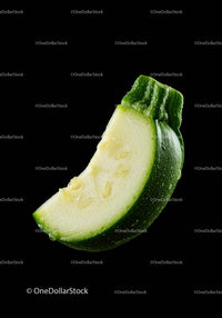 Fresh green zucchini slice with water droplets
