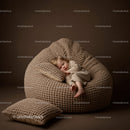 Sleeping toddler in cozy knitted bean bag chair