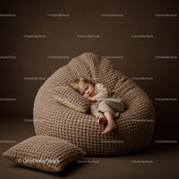 Sleeping toddler in cozy knitted bean bag chair