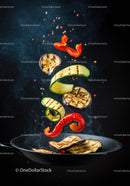Grilled vegetables tossing in a sizzling pan with spices
