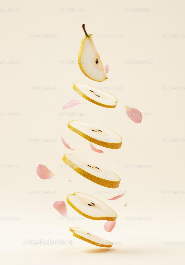 Floating Sliced Pear with Delicate Pink Petals