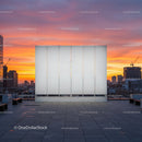 Empty White Billboard on City Rooftop with Vibrant Sunset Sky