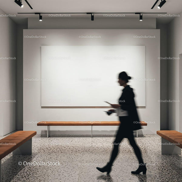 Person walking past blank canvas in modern gallery JPG Mockup Image