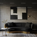 Modern living room with black sofa and abstract art