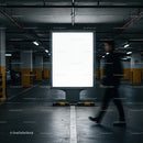 Empty illuminated billboard in dim underground parking lot