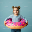 Little girl holding colorful donut shaped pool float