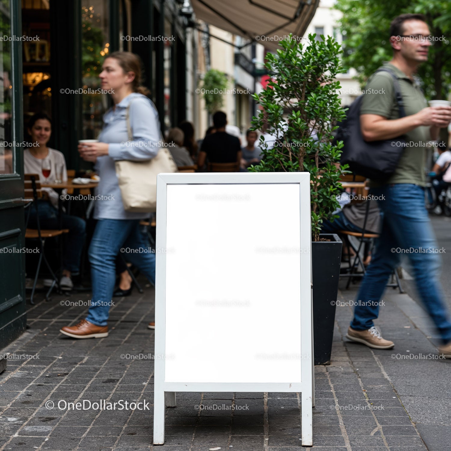 Blank white sidewalk sign outside busy cafe