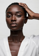 Elegant African Woman Portrait with Natural Makeup and Confident Expression