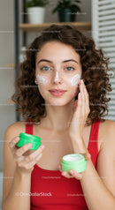 Young Woman Applying Moisturizer for Glowing Skin