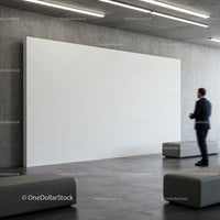 Businessman Standing in Modern Gallery with Blank Canvas