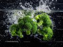 Fresh Green Broccoli Heads Splashing Water in High-Resolution