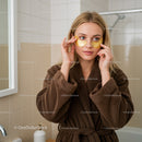 Woman Using Under Eye Patches for Skin Care in Bathroom