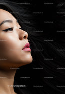 Profile of a woman with flowing dark hair and makeup