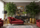Elegant living room with red chaise lounge and green plants