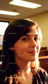 Natural light illuminates young woman’s serene smile