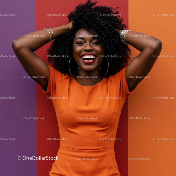 Vibrant Happy Woman in Orange Dress with Curly Hair Against Colorful Wall