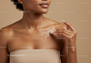 Close-up of Woman Applying Sunscreen Lotion on Shoulder for Sun Protection