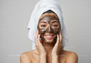 Young Woman Applying Clay Facial Mask for Skin Rejuvenation