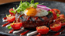 Gourmet Steak with Egg and Cherry Tomatoes on Black Plate