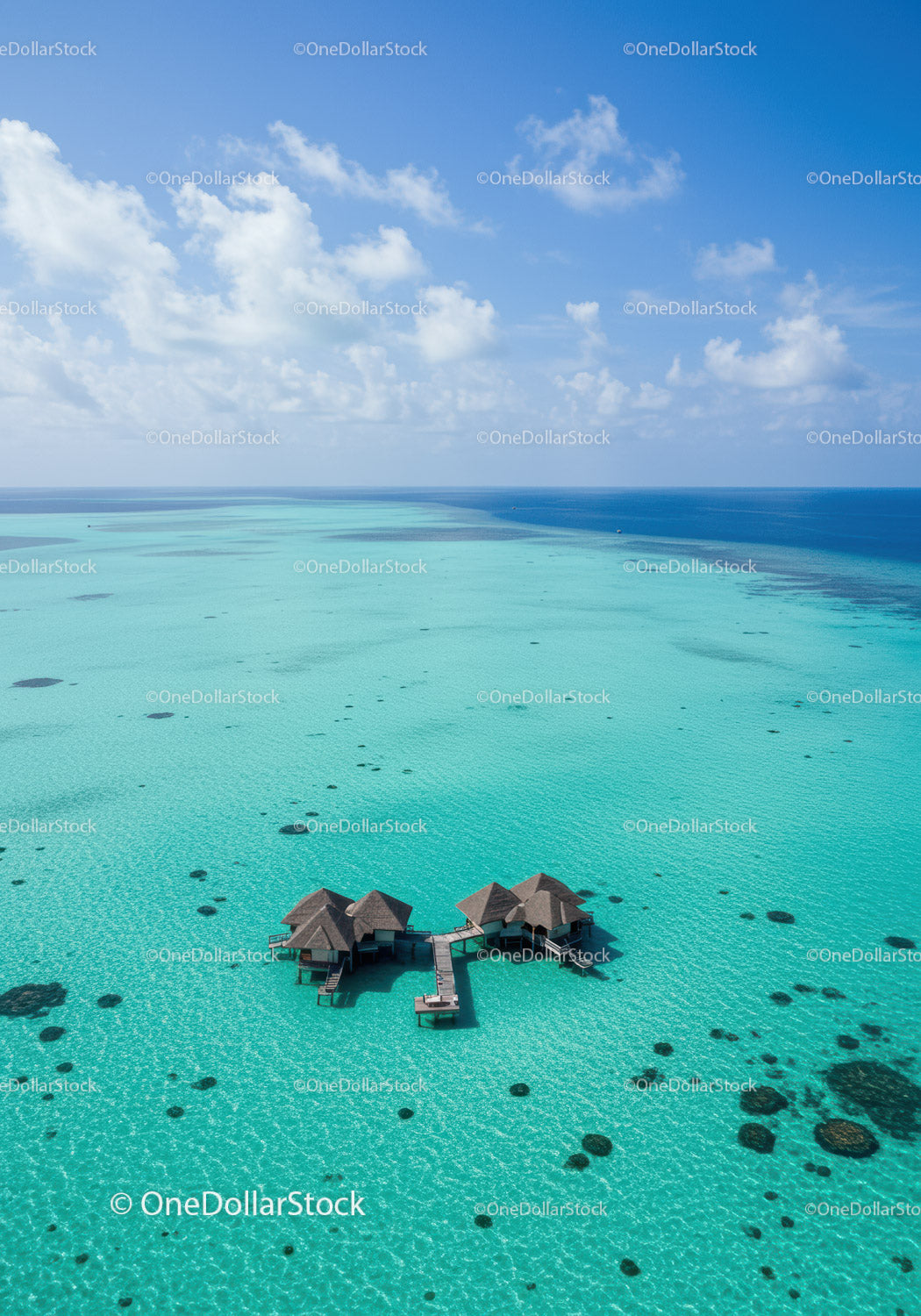 Overwater Bungalows in Turquoise Lagoon with Clear Blue Sky