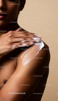 Close up of woman applying moisturizer on shoulder