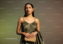 Elegant Fashion Portrait of a Woman in Stylish Dress with Gold Jewelry